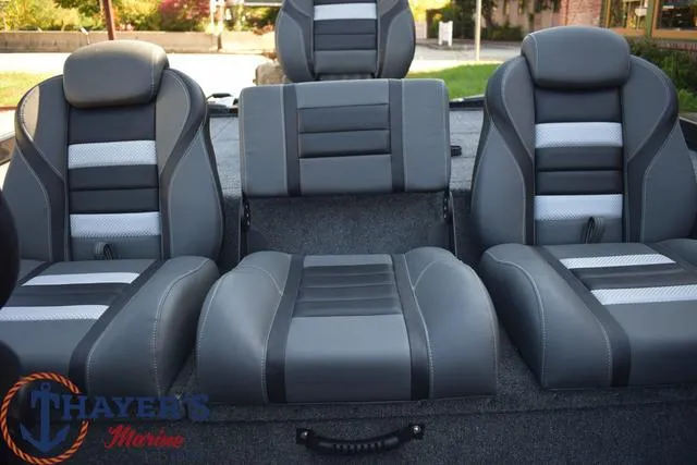 Slide: The Image of 2024 Ranger RT178 boat interior with gray and black cushioned seats. - 17