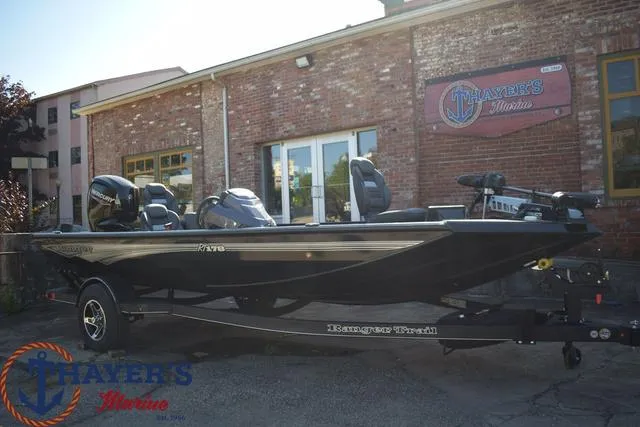 Slide: The Image of 2024 Ranger RT178 fishing boat displayed outside Thayer's Marine dealership. - 26