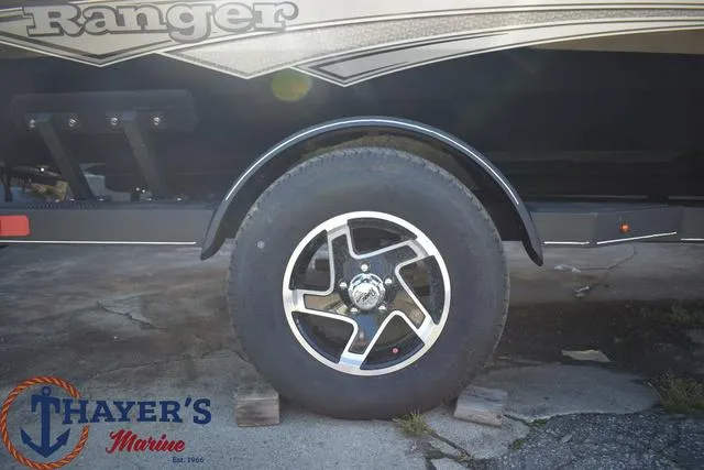 Slide: The Image of 2024 Ranger RT178 boat trailer wheel at Thayer's Marine. - 4