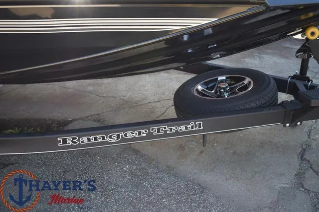 Slide: The Image of 2024 Ranger RT178 boat trailer with Ranger Trail branding at Thayer's Marine. - 5
