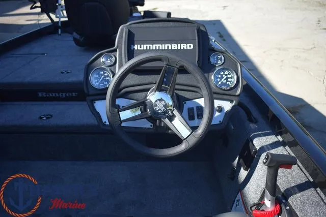 Slide: The Image of 2024 Ranger RT178 boat dashboard with Humminbird electronics and steering wheel. - 9
