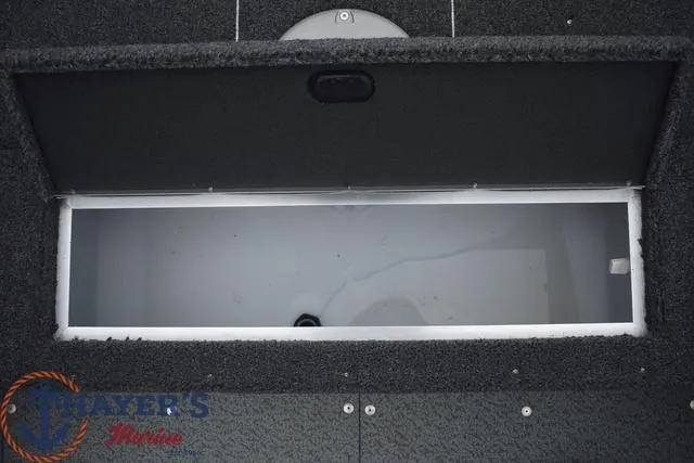 Slide: The Image of Open storage compartment of 2024 Lund 1600 Fury Tiller boat. - 12