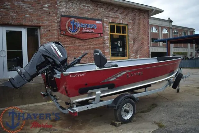 Slide: The Image of 2024 Lund 1600 Fury Tiller boat on trailer at Thayer's Marine dealership. - 18