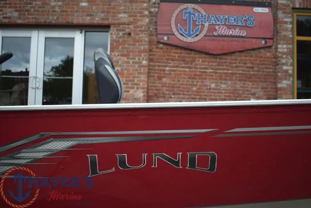 Slide: The Image of 2024 Lund 1600 Fury Tiller boat at Thayer's Marine dealership. - 6