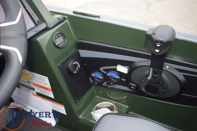 Slide: The Image of Control panel of 2024 Triton 20XP boat with throttle and switches. - 11