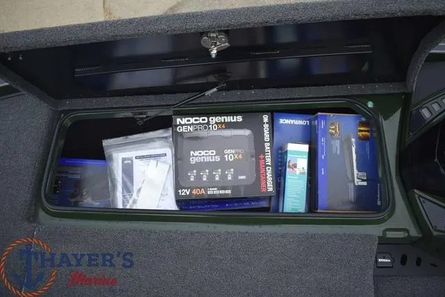 Slide: The Image of Storage compartment of 2024 Triton 20XP boat with NOCO Genius battery charger. - 15