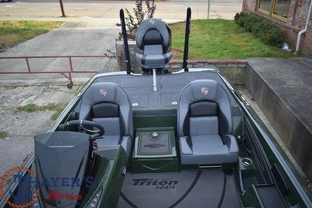 Slide: The Image of 2024 Triton 20XP boat interior with three seats and steering console. - 19