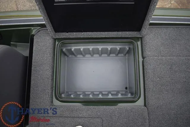 Slide: The Image of 2024 Triton 20XP boat storage compartment with open lid. - 25