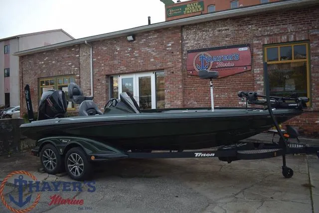 Slide: The Image of 2024 Triton 20XP bass boat at Thayer's Marine dealership. - 29
