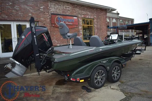Slide: The Image of 2024 Triton 20XP boat at Thayer's Marine dealership. - 3