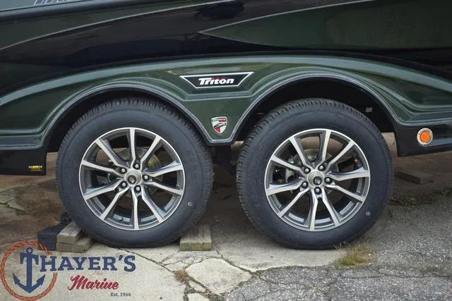Slide: The Image of 2024 Triton 20XP boat trailer with dual wheels at Thayer's Marine. - 5