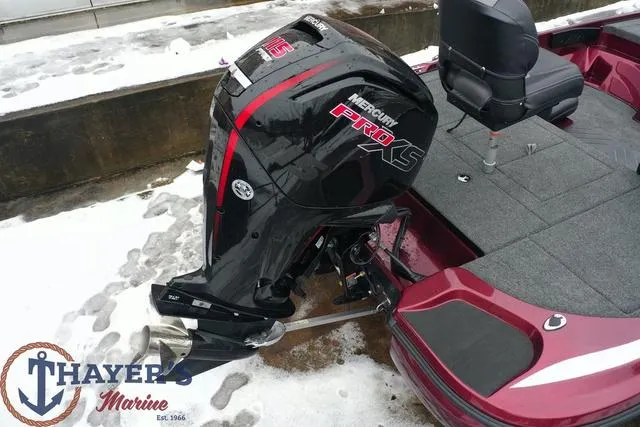 Slide: The Image of 2024 Nitro Z17 boat with Mercury Pro XS outboard motor in snowy setting. - 11