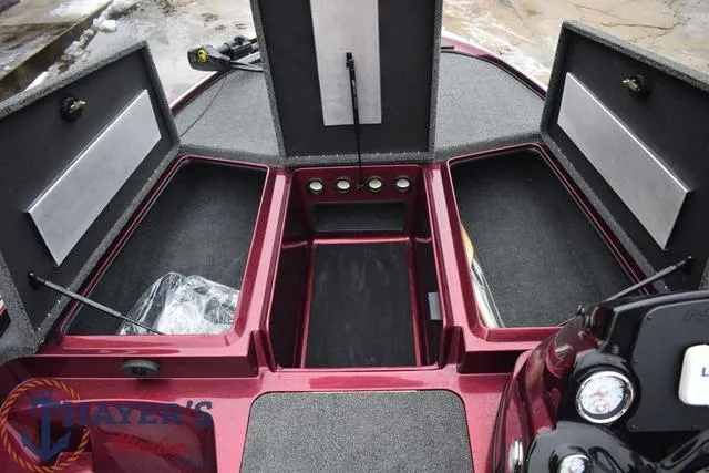 Slide: The Image of 2024 Nitro Z17 boat storage compartments open, showcasing ample space and organized layout. - 14