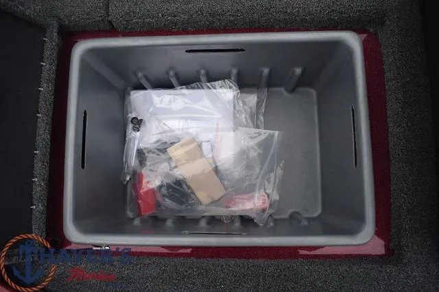 Slide: The Image of Storage compartment of 2024 Nitro Z17 boat with accessories in plastic bags. - 23