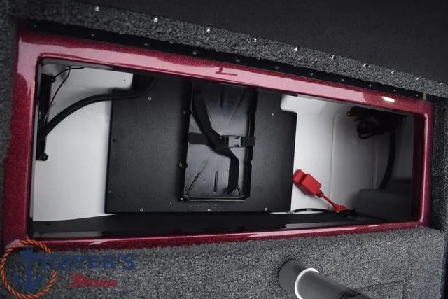 Slide: The Image of Storage compartment of 2024 Nitro Z17 boat with wiring and battery components. - 26