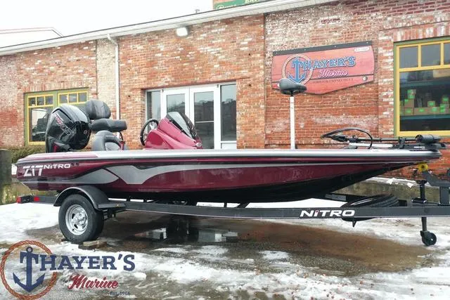 Slide: The Image of 2024 Nitro Z17 boat on trailer at Thayer's Marine dealership. - 28