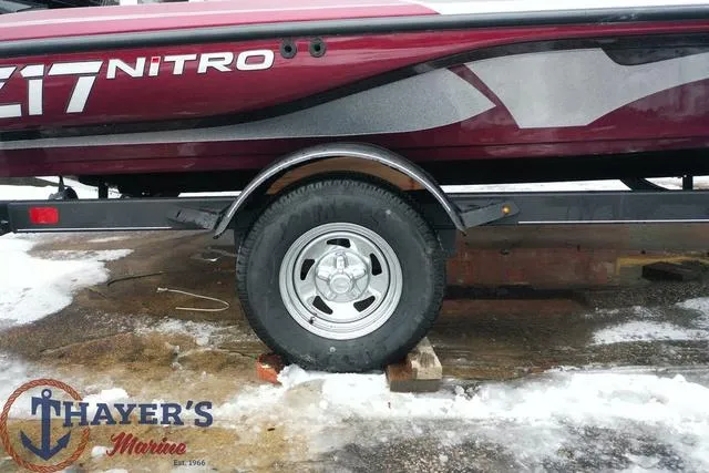 Slide: The Image of 2024 Nitro Z17 boat trailer wheel at Thayer's Marina. - 32