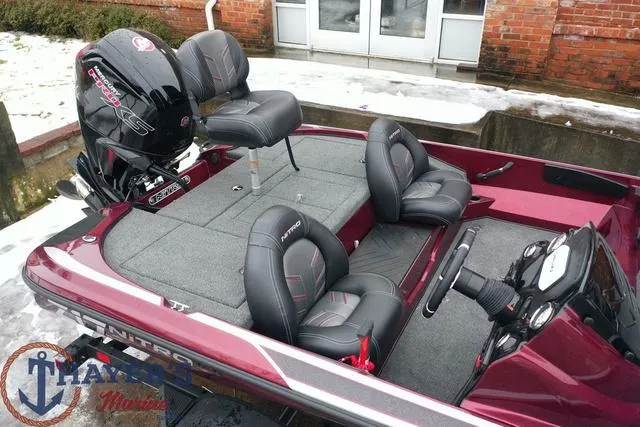 Slide: The Image of 2024 Nitro Z17 fishing boat with Mercury Pro XS engine, gray and red interior. - 6