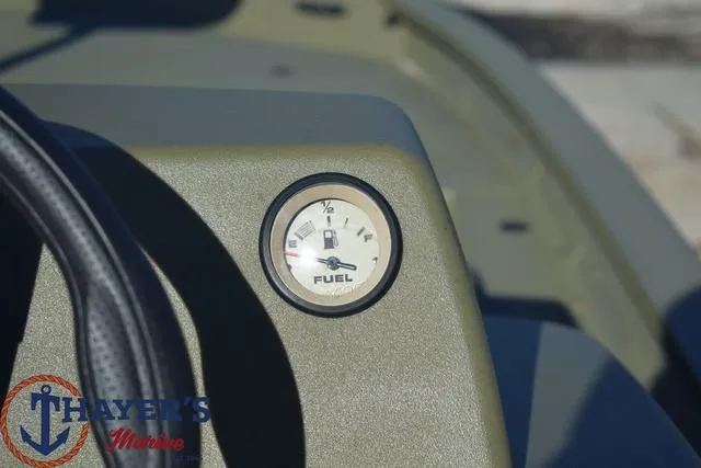 Slide: The Image of Close-up of 2024 Tracker GRIZZLY® 1754 SC fuel gauge on dashboard. - 10