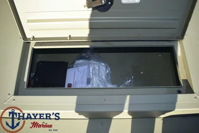 Slide: The Image of Storage compartment of 2024 Tracker GRIZZLY® 1754 SC boat at Thayer's Marine. - 14