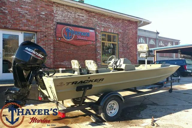 Slide: The Image of 2024 Tracker GRIZZLY® 1754 SC boat on trailer at Thayer's Marine. - 22
