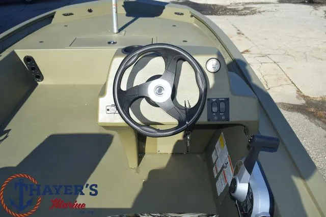 Slide: The Image of 2024 Tracker GRIZZLY® 1754 SC boat steering console at Thayer's Marine. - 8