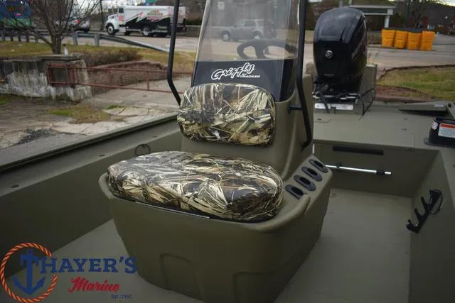 Slide: The Image of 2024 Tracker GRIZZLY® 1860 CC boat interior with camo seats at Thayer's Marine. - 12