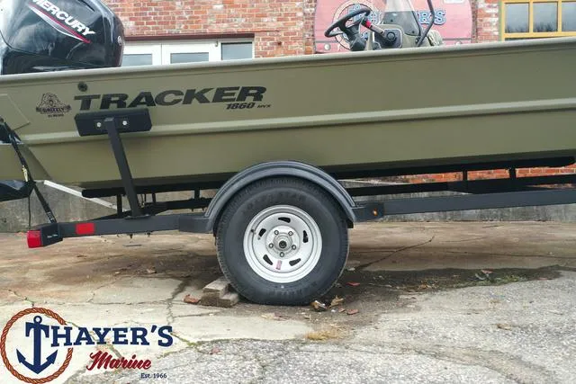 Slide: The Image of 2024 Tracker GRIZZLY® 1860 CC boat on trailer at Thayer's Marine. - 6