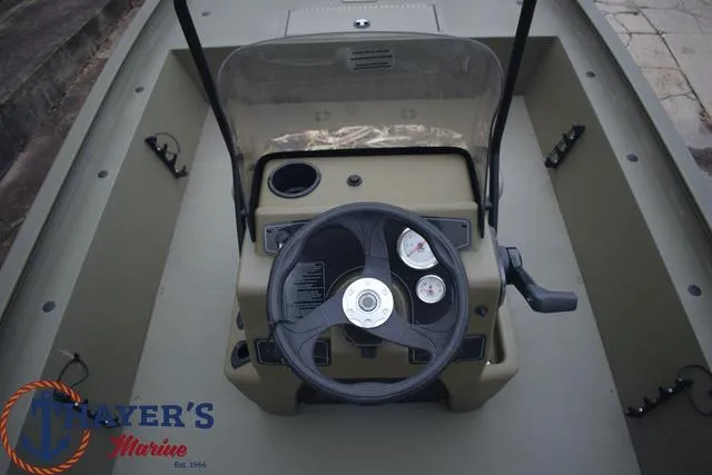 Slide: The Image of 2024 Tracker GRIZZLY® 1860 CC boat console with steering wheel and gauges. - 8