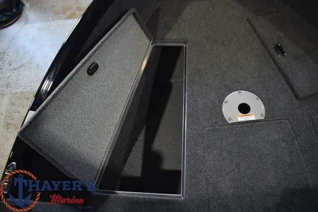 Slide: The Image of 2024 Lund 1875 Impact XS Sport boat interior storage compartment. - 13