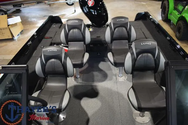 Slide: The Image of 2024 Lund 1875 Impact XS Sport boat interior with four seats. - 17