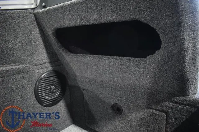 Slide: The Image of 2024 Lund 1875 Impact XS Sport interior with speaker and storage compartment. - 21
