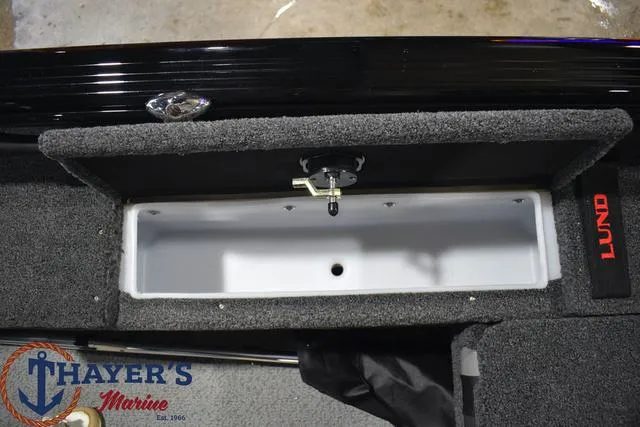 Slide: The Image of 2024 Lund 1875 Impact XS Sport boat storage compartment at Thayer's Marine. - 23