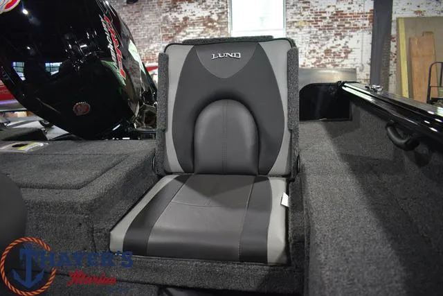 Slide: The Image of 2024 Lund 1875 Impact XS Sport boat seat with Honda motor in background. - 26