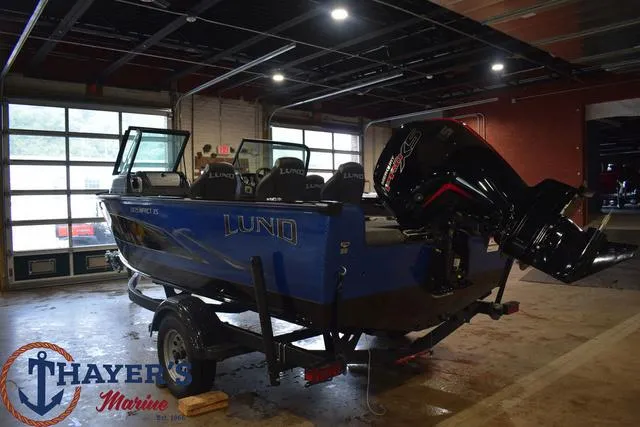 Slide: The Image of 2024 Lund 1875 Impact XS Sport boat in a showroom at Thayer's Marine. - 3