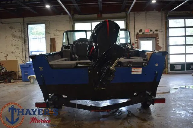 Slide: The Image of 2024 Lund 1875 Impact XS Sport boat in a garage at Thayer's Marine. - 4