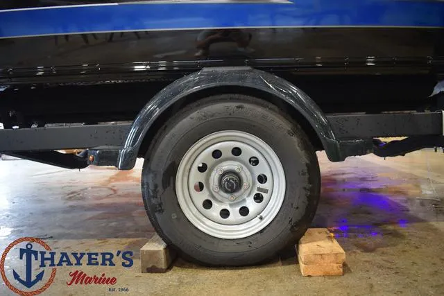 Slide: The Image of 2024 Lund 1875 Impact XS Sport boat trailer wheel at Thayer's Marine. - 7