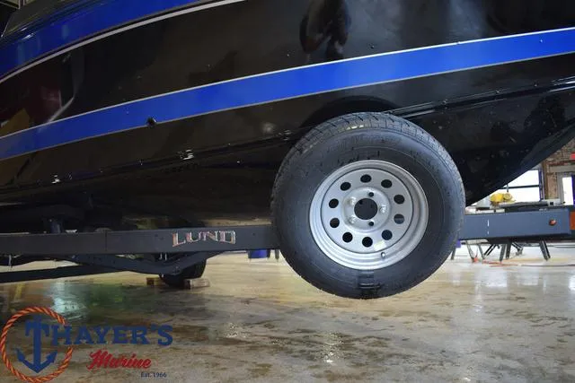 Slide: The Image of 2024 Lund 1875 Impact XS Sport boat on trailer at Thayer's Marine. - 8