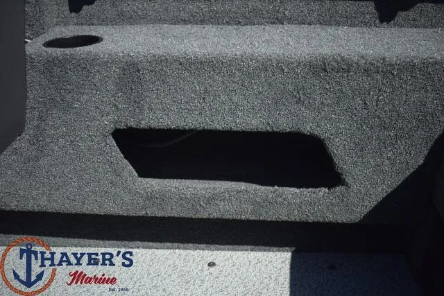 Slide: The Image of 2024 Lund 1675 Adventure Sport boat interior with Thayer's Marine logo. - 14