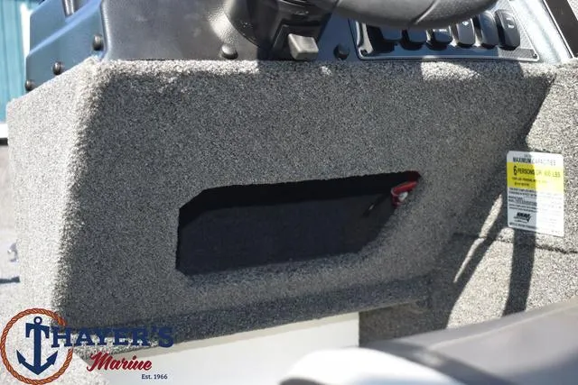 Slide: The Image of 2024 Lund 1675 Adventure Sport boat console with storage compartment. - 15