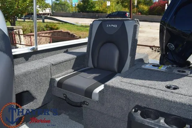 Slide: The Image of 2024 Lund 1675 Adventure Sport boat seat with Thayer's Marine logo. - 19