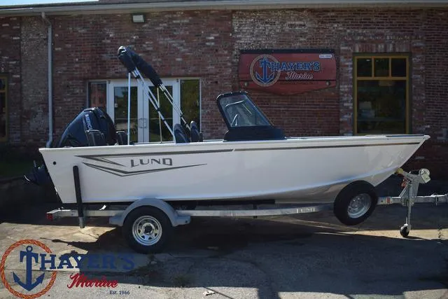 Slide: The Image of 2024 Lund 1675 Adventure Sport boat on trailer outside Thayer's Marine. - 24
