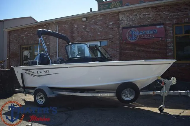Slide: The Image of 2024 Lund 1675 Adventure Sport boat on trailer outside Thayer's Marine. - 25