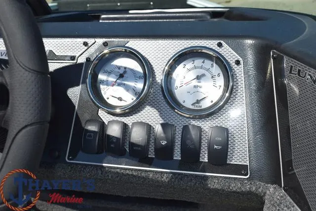 Slide: The Image of Dashboard of 2024 Lund 1675 Adventure Sport boat with gauges and switches. - 9