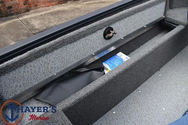 Slide: The Image of 2024 Lund 1650 Angler Sport boat storage compartment at Thayer's Marine. - 12