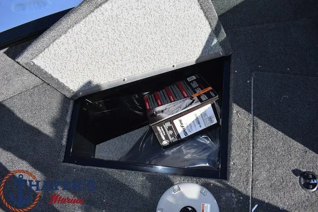 Slide: The Image of Storage compartment in 2024 Lund 1650 Angler Sport boat with accessories. - 16