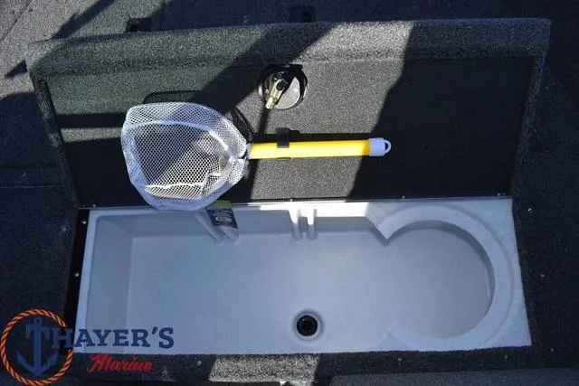 Slide: The Image of 2024 Lund 1650 Angler Sport livewell with net and Thayer's Marine logo. - 17
