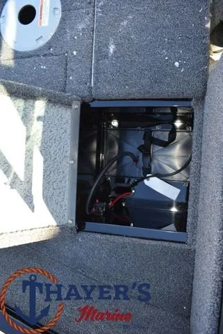 Slide: The Image of 2024 Lund 1650 Angler Sport battery compartment at Thayer's Marine. - 18