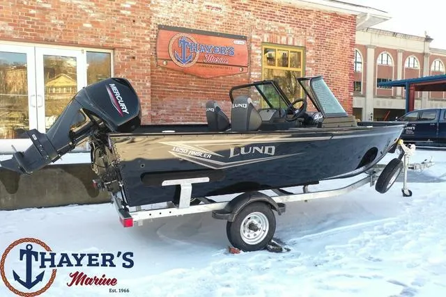 Slide: The Image of 2024 Lund 1650 Angler Sport boat on trailer at Thayer's Marine dealership. - 20