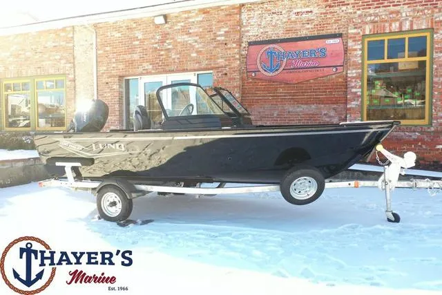 Slide: The Image of 2024 Lund 1650 Angler Sport boat on trailer at Thayer's Marine dealership. - 23